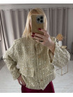 Veste à séquins dorés