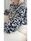 blouse noir blanc broderie boutons motifs poignets volants col rond