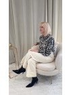 blouse noir blanc broderie boutons motifs poignets volants col rond