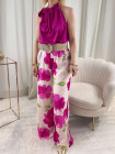 Pantalon blanc à fleurs fuchsia